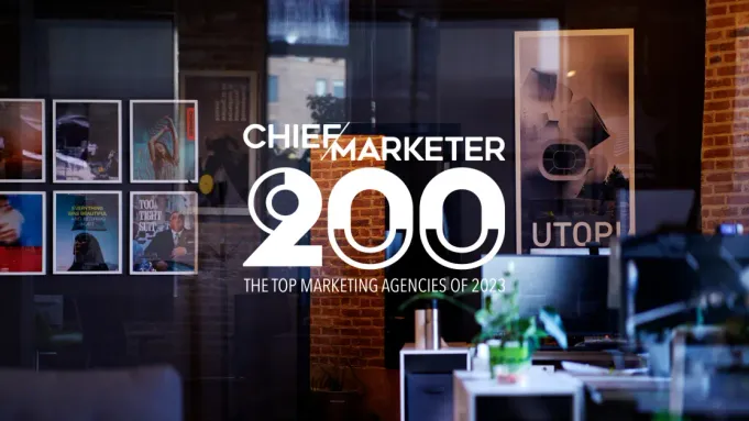 Next/Now office overlayed with text "Chief Marketer 200 - The Top Marketing Agencies of 2023"